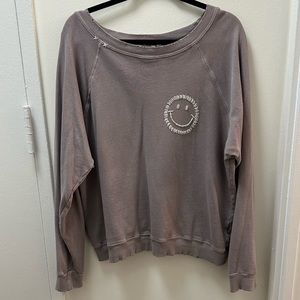 Gray distressed crewneck sweatshirt with white stitched smiley face